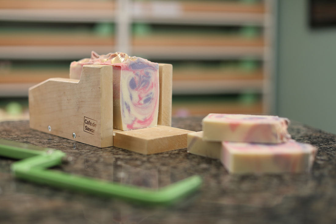 large bar of soap being cut into slices