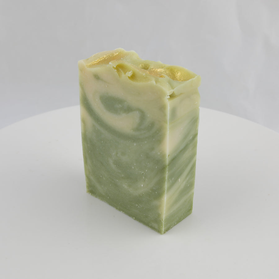 cream and green colored bar of soap