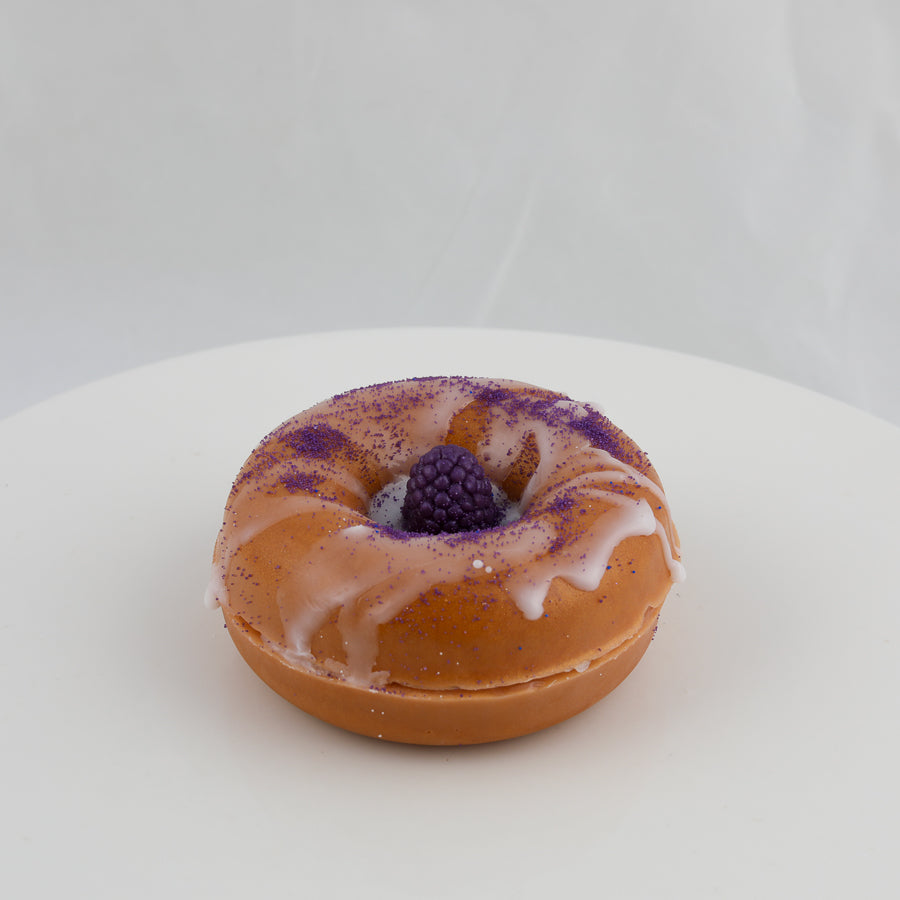 donut shaped soap with a blackberry in the middle