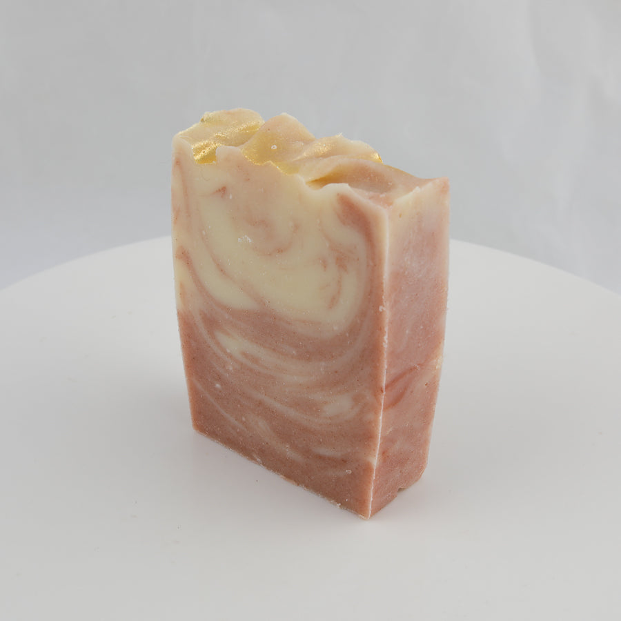 cream, peach and gold swirl colored bar of soap