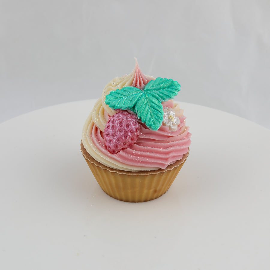 pink, brown, and cream cupcake shaped soap with a raspberry, green leaves, and pearl colored flower on top