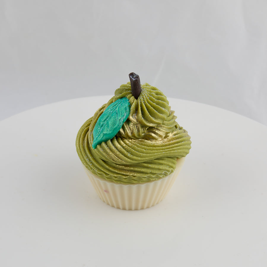 cream and green cupcake shaped soap with a turquoise leaf and brown stem on top
