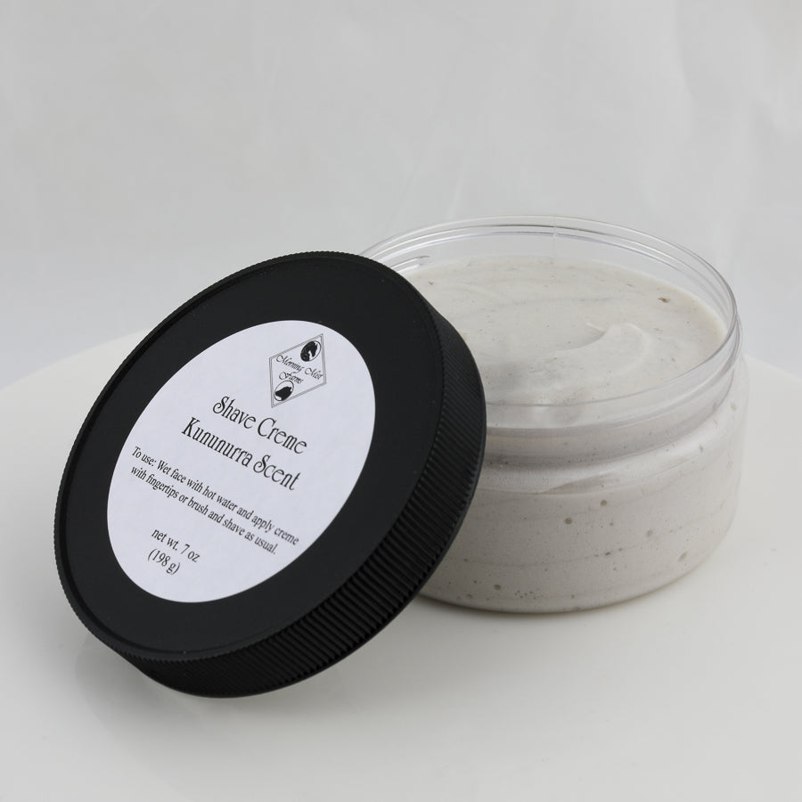 open jar of off-white colored shave creme, kununurra scent