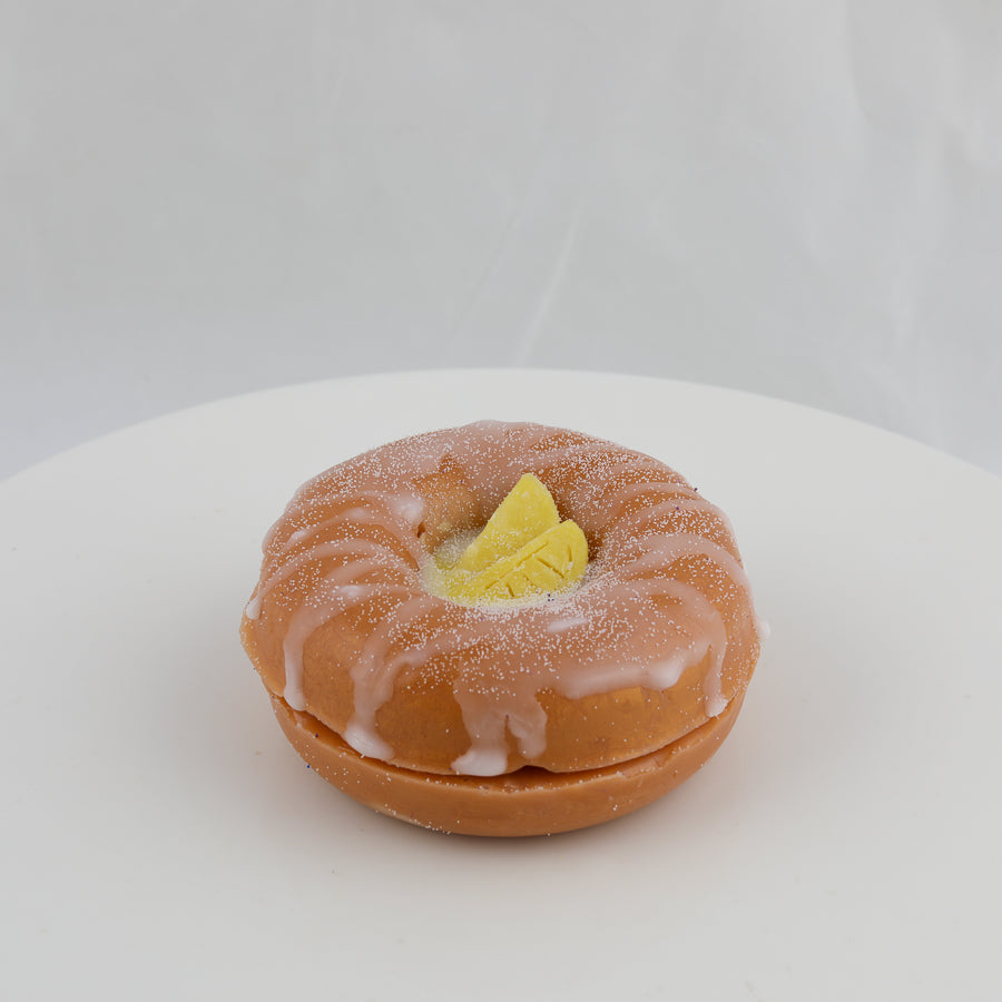 donut shaped soap with slices of lemon in the center