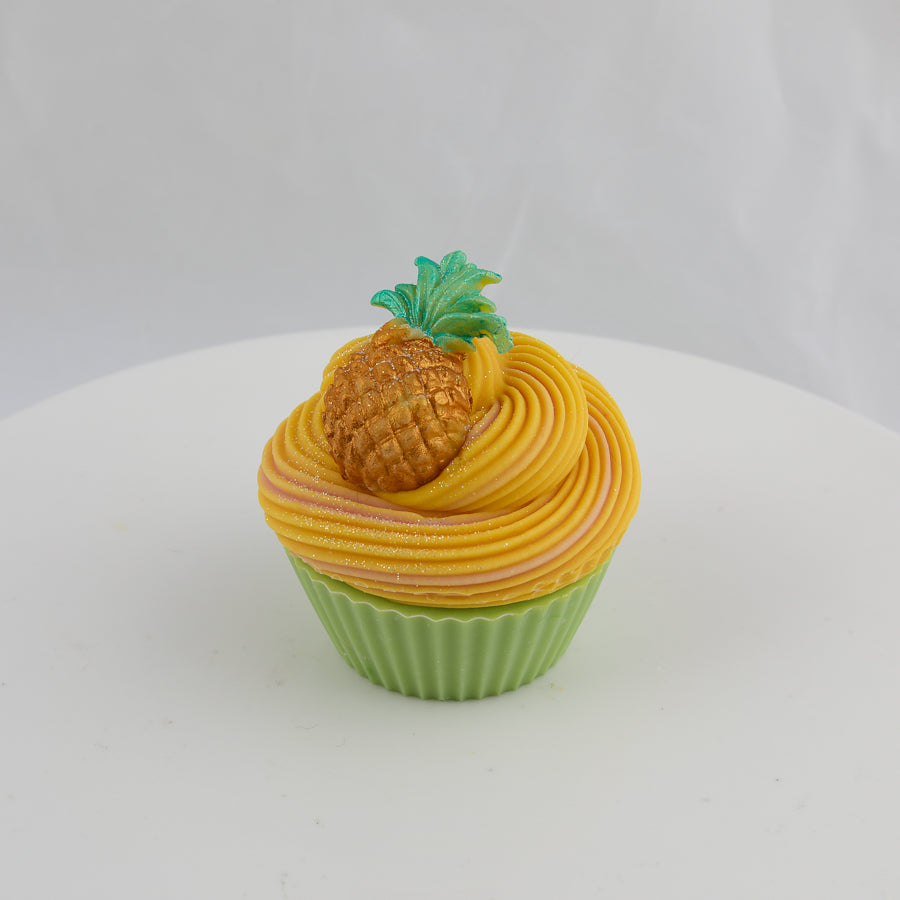 green and yellow, cupcake shaped soap with a pineapple on top
