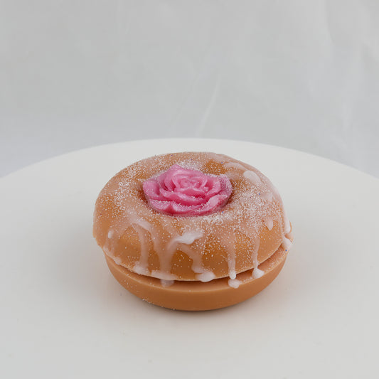 donut shaped soap with a rose in the center