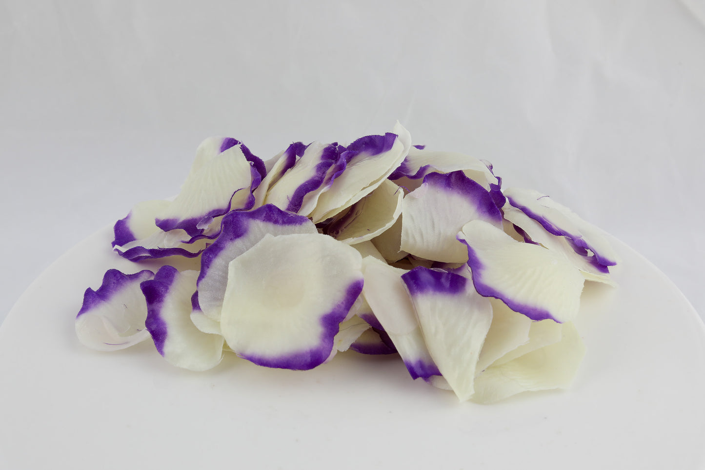 soap shaped as flower petals in cream with violet edges