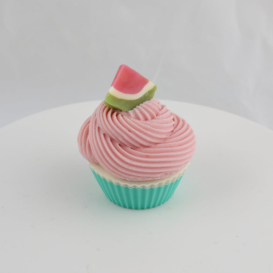 green, pink, and cream colored cupcake shaped soap with a slice of watermelon on top