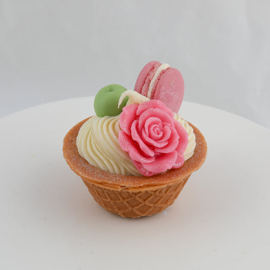 cream and brown waffle cone soap with a grape, a pink rose, and a pink macaroon on top