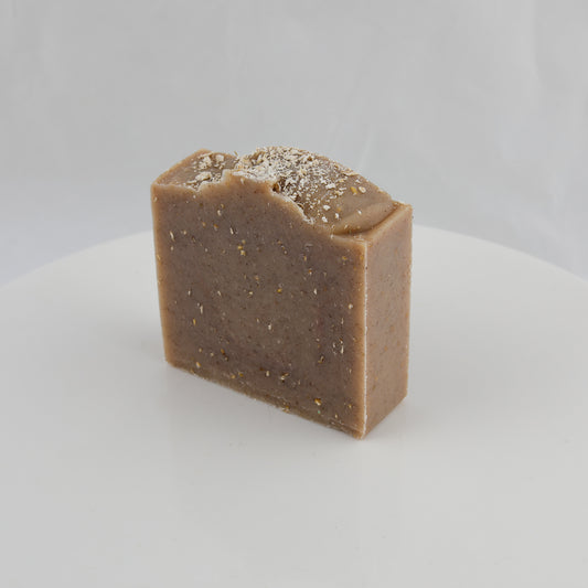 brown general use bar of soap with crushed oatmeal speckles