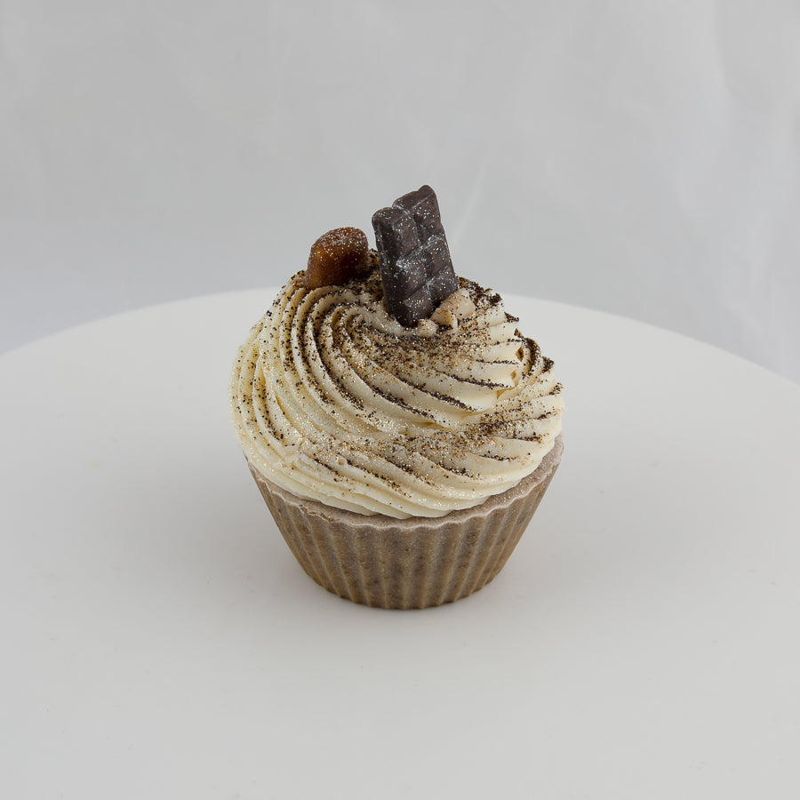 cream and brown colored, cupcake shaped soap with a bar of chocolate and coffee bean on top