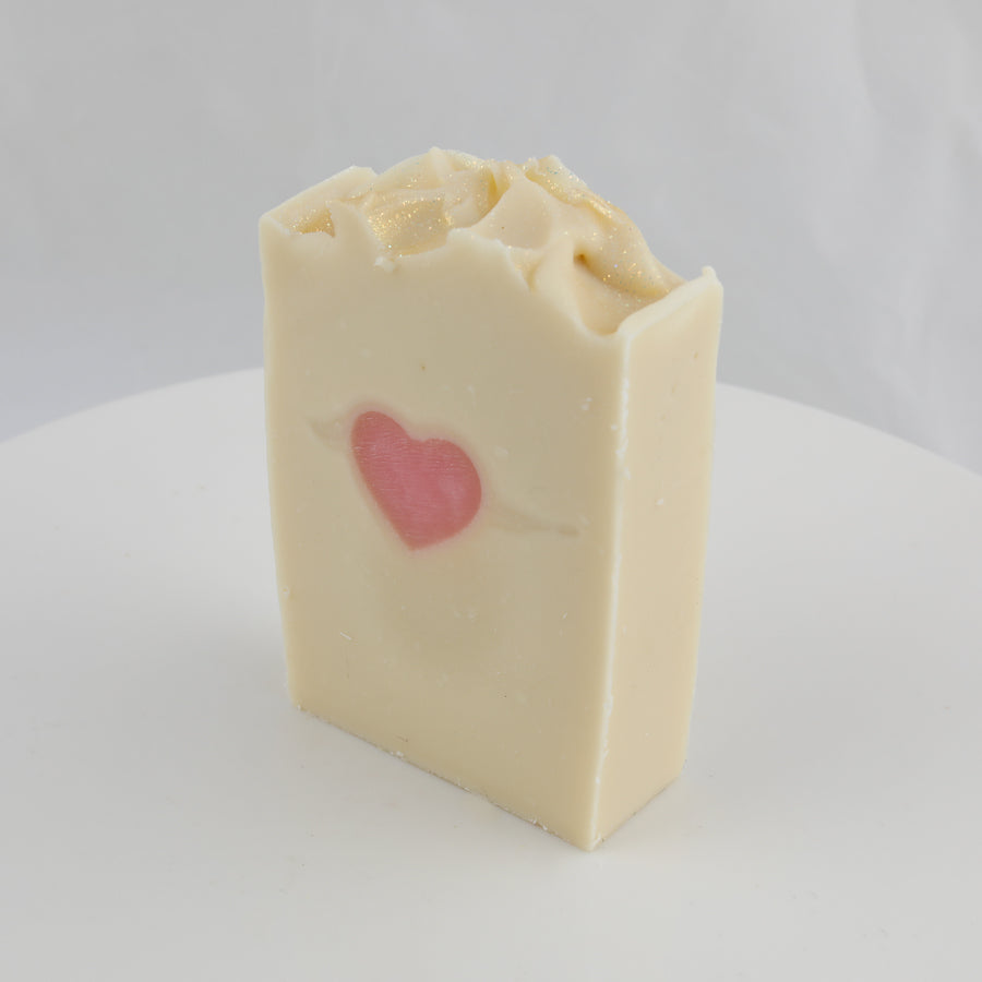 cream bar of soap with a heart in the center