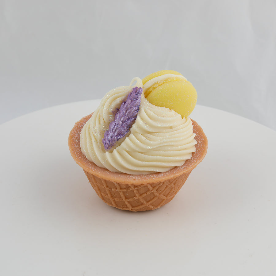 brown and cream colored ice cream bowl soap with a purple lavender sprig and a yellow macaroon on top