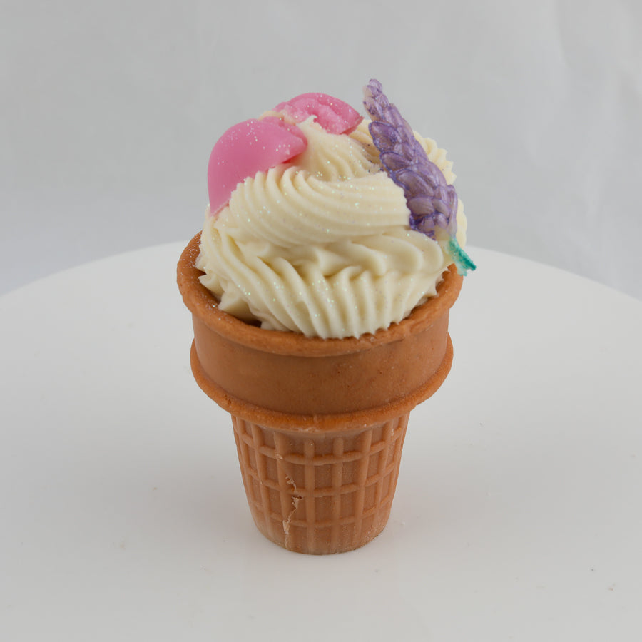 brown and cream colored ice cream bowl soap with a purple lavender sprig and a pink macaroon on top