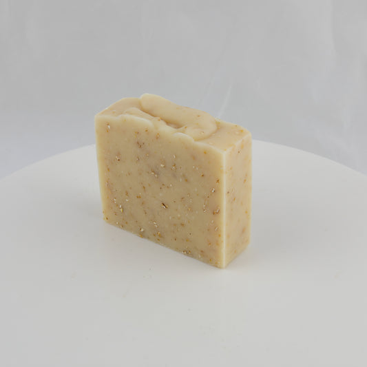 cream colored bar of general use soap with crushed oatmeal mixed in