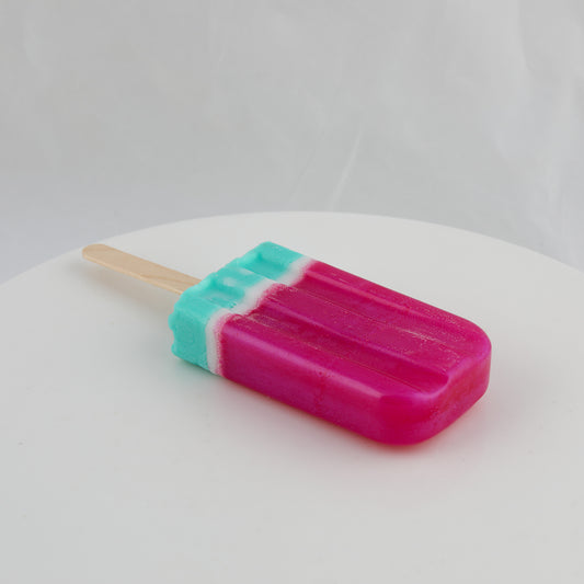 popsicle shaped soap with green, white, and bright pink colors